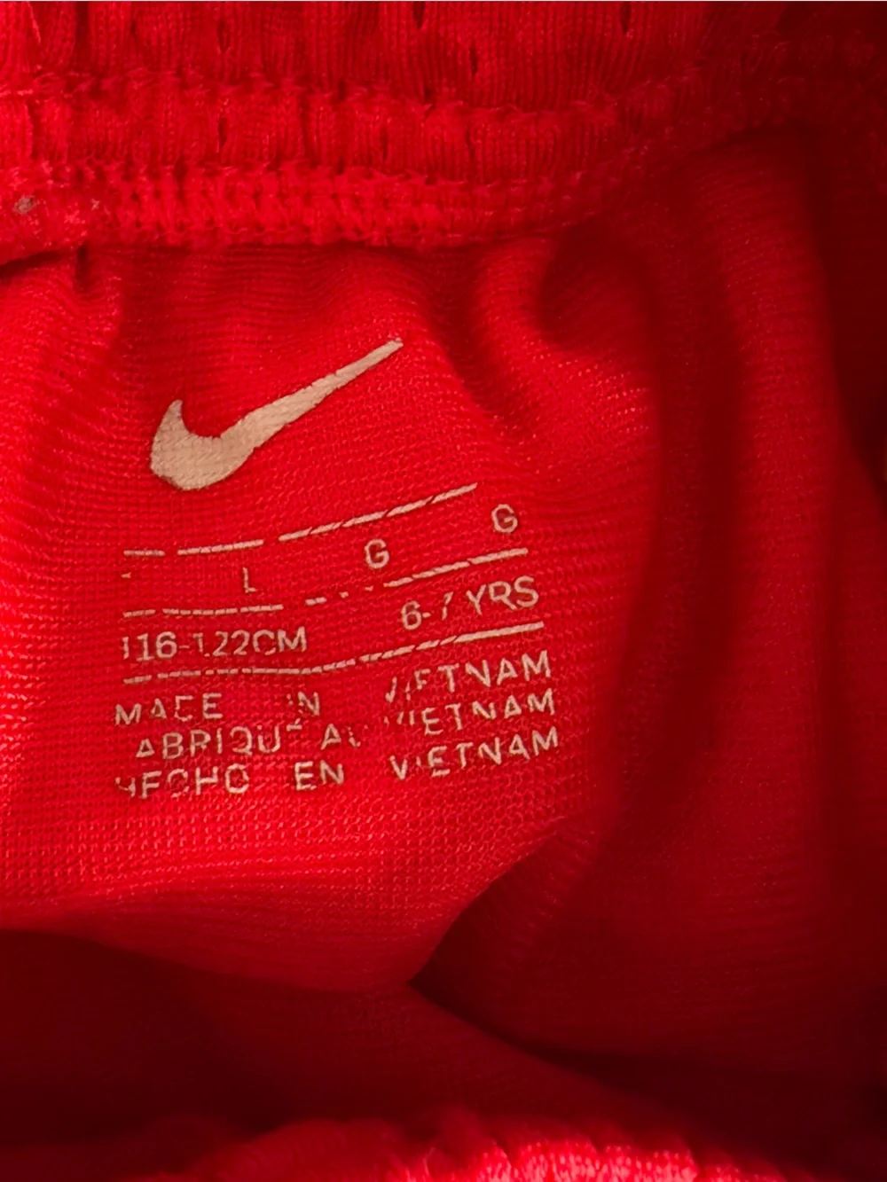 Nike Bright Red Kids Mesh Athletic Shorts with White Swoosh